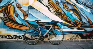 The Best Road Bikes for Beginners: A road bike in front of an abstractly painted wall
