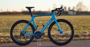 Best Chinese Carbon Road Bikes: Blue, custom painted YOELEO R12 with a countryside background