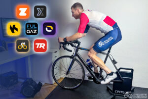 Best Indoor Cycling Apps: Me riding on a Cycplus T3 bike trainer looking at the icons of the best indoor cycling apps (Zwift, ROUVY, TrainerRoad, Wahoo SYSTM, MyWhoosh, Kinomap, and FulGaz).