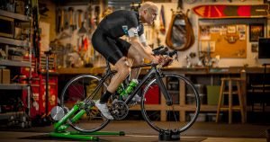 Best Bike Trainer Tires: A man training indoors on a Kinetic trainer