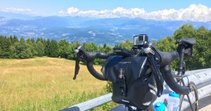 Craft Cadence handlebar bag review: The bag mounted on my road bike with Italian Alps in the background