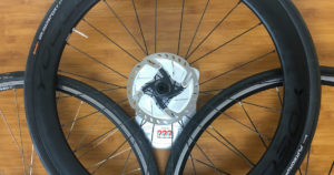 How much do road bike wheels weigh? YOELEO road bike wheel on a kitchen weight and a wooden table