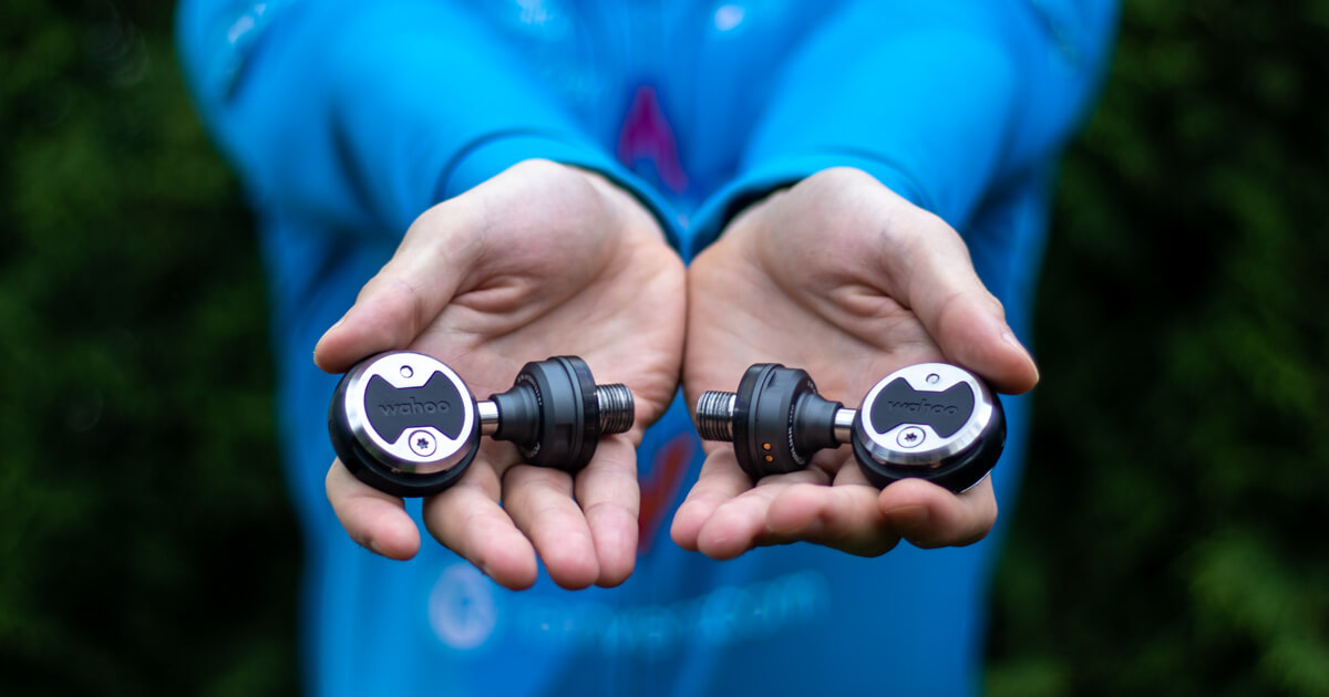 Wahoo POWRLINK Zero power meter pedals in my hands.