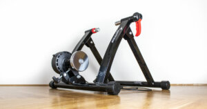 Sportneer Bike Trainer Stand review: Sportneer bike trainer on a wooden floor.