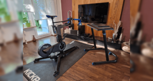 Wahoo KICKR Bike review: Wahoo KICKR Bike in a living room in front of a TV, on KICKR mat