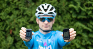 Me holding Wahoo ELEMNT BOLT v1 vs. v2.