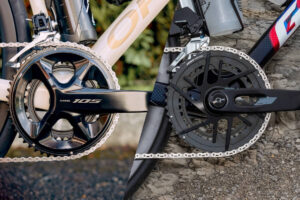 Shimano 105 Di2 groupset (left side) vs. SRAM Rival eTap AXS groupset (right side).