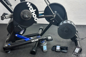 Wahoo Black Friday Deals: Multiple Wahoo products on a black trainer mat (Wahoo KICKR, Wahoo KICKR Core, Wahoo ELEMNT BOLT 1, BOLT 2, ROAM, and TICKR).