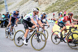 Best Road Bikes Over $10,000: Jan Hirt, Remco Evenepoel, and other professional riders riding uphill on expensive road bikes. Source: Sirotti (edited)