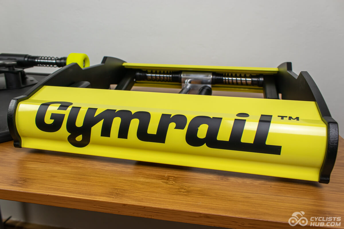 The unassembled front part of the Gymrail Momentum X1 on a wooden table.