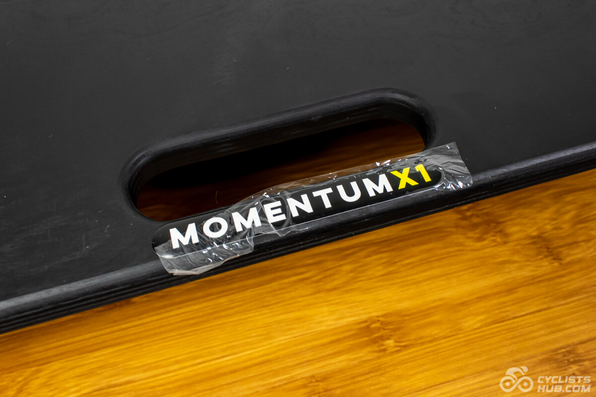 Detail on the covered Momentum X1 logo.