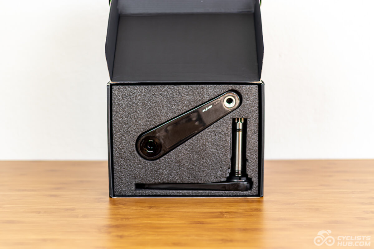 Elilee X310 cranks in an opened box on a wooden table.