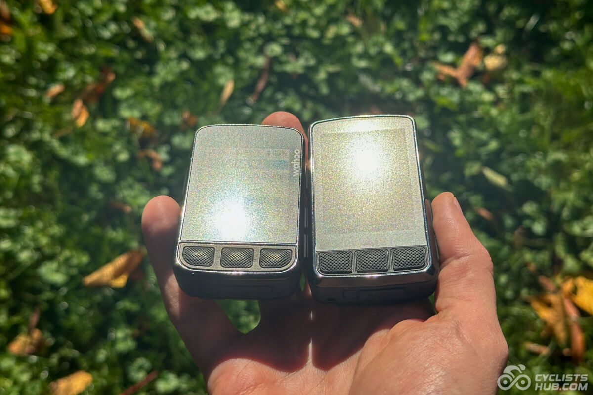 Me holding the Wahoo ELEMNT BOLT v2 vs. v3 showing their readability in direct sunlight.