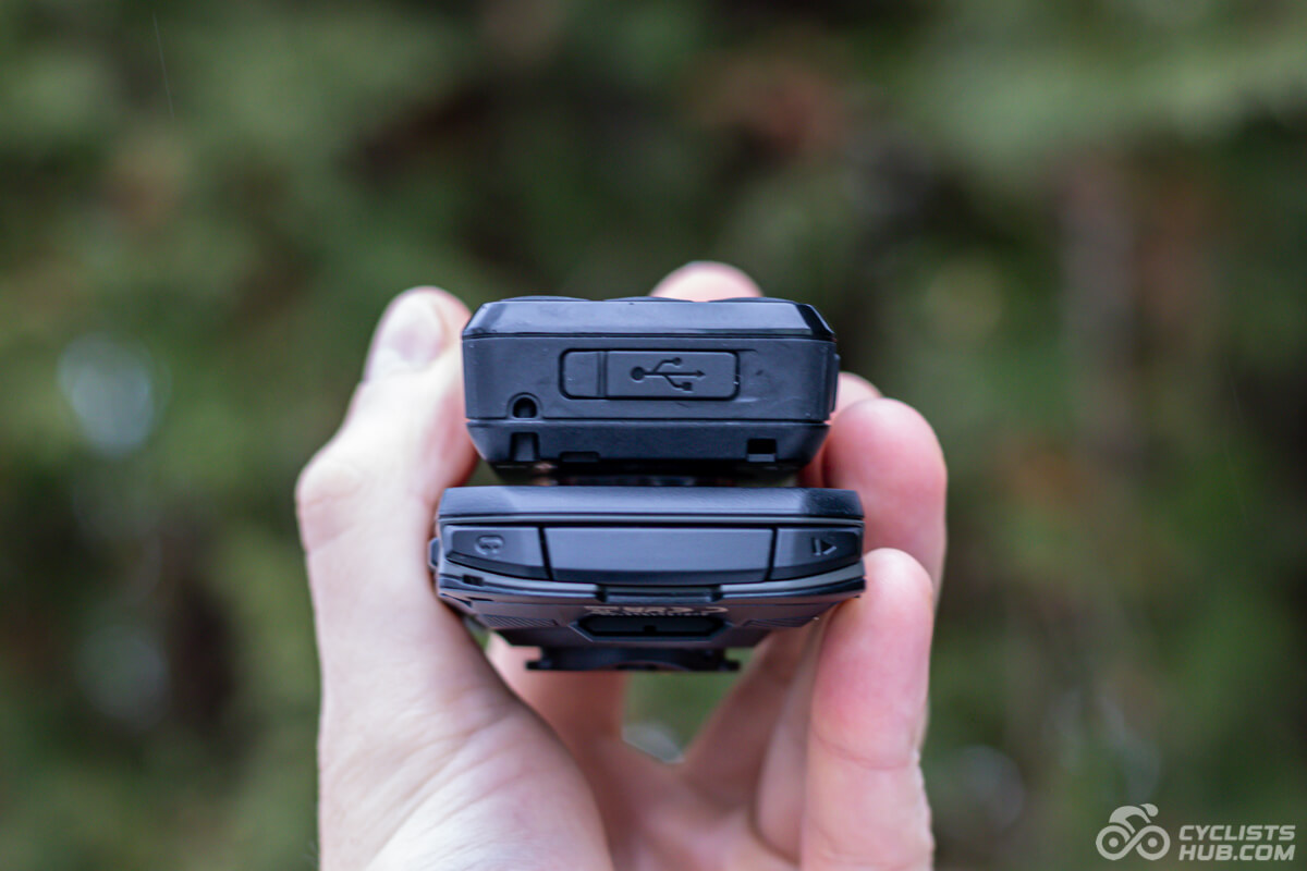 Me holding the Garmin Edge 550 vs. Wahoo ELEMNT BOLT 3 showing the bottom side.