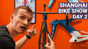 Petr Minarik pointing at the new Elilee frameat the Shanghai Bike Show 2026.