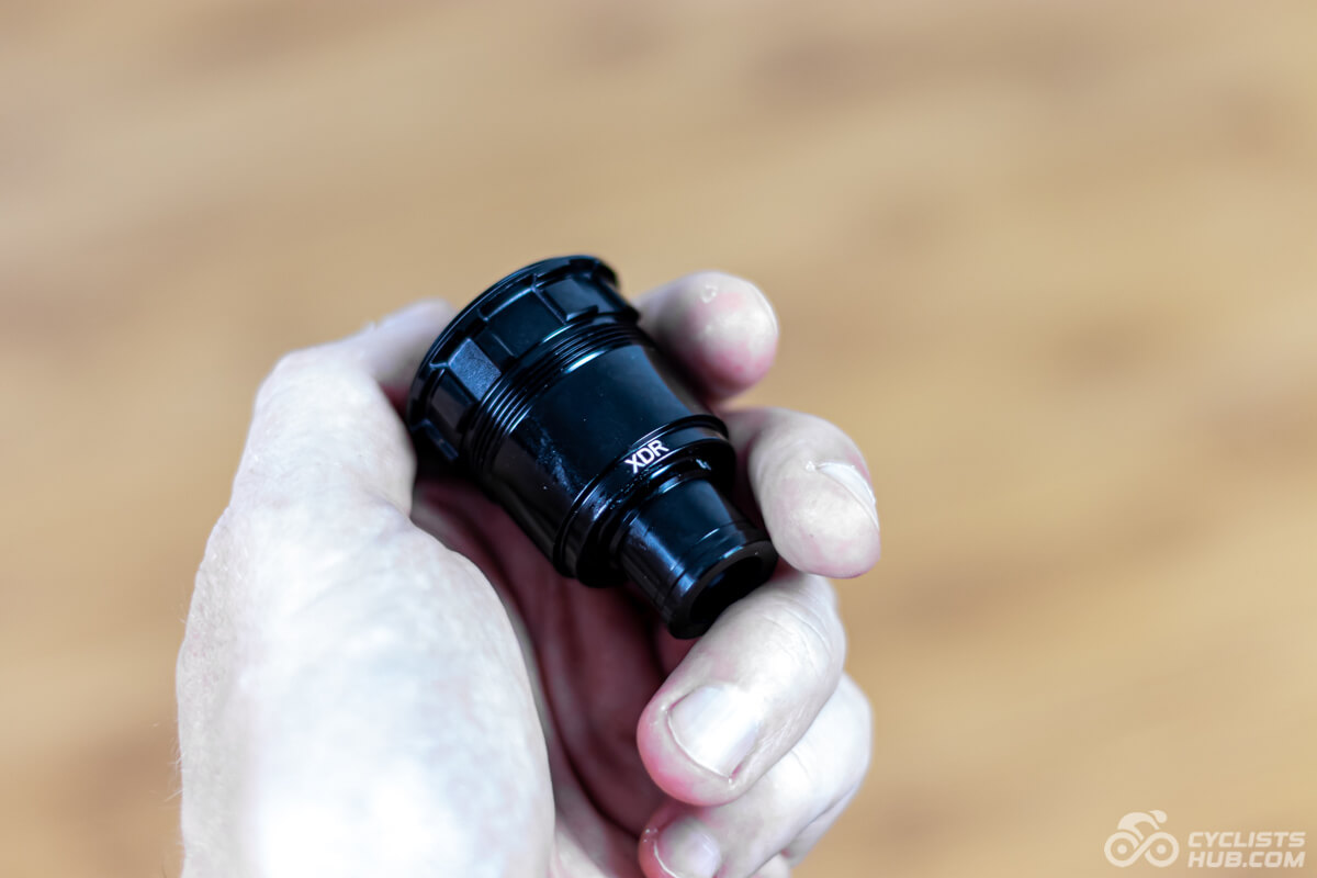 Me holding the 10Plus T-Series 50mm XDR freehub.