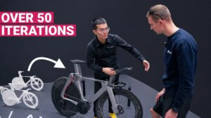 Philip from Incolor explaining the engineering behind the Incolor TTR bike (in front of Philip) while Petr from CyclistsHub.com is listening.