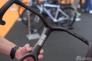Me holding the VOOK V9 forkbar at the Shanghai Bike Expo 2026.
