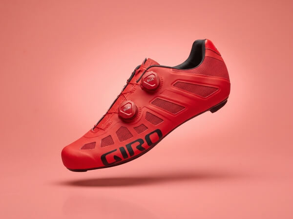 Bright red Giro Imperial road cycling shoe with dual BOA dials and breathable mesh panels, side view.